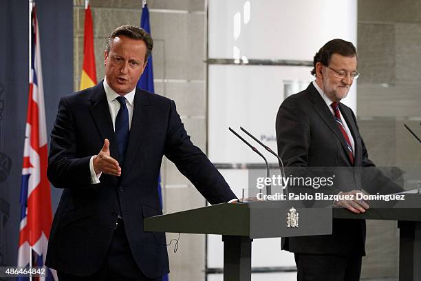 British Prime Minister David Cameron speaks next to Spanish Prime Minister Mariano Rajoy during a press conference at Moncloa Palace on September 4,...