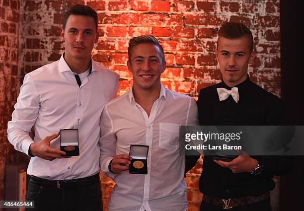 Gold medal winner Felix Passlack of Borussia Dortmund , bronze medal winner Constantin Frommann and silver medal winner Niklas Dorsch of Bayern...