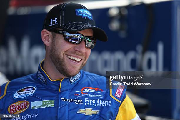 Regan Smith, driver of the Hellmann's Chevrolet, prepares to drive during practice for the NASCAR Nationwide Series 27th Annual ToyotaCare 250 at...