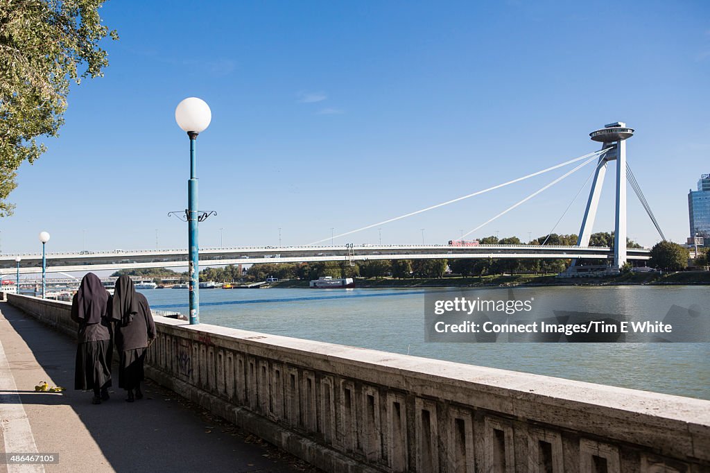Two nuns walking by the river Danube, Bratislava, Slovakia