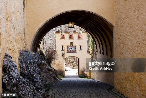 entrance gate of the schloss hohenschwangau, germany - hohenschwangau castle stock pictures, royalty-free photos & images