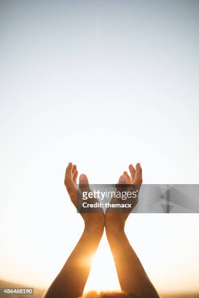 hands raised up - religion stock pictures, royalty-free photos & images