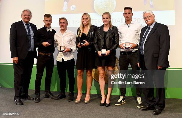 German Football Association DFB Vice-President for Youth Football Hans-Dieter Drewitz poses with U17 silver medal winner Niklas Dorsch, U17 gold...