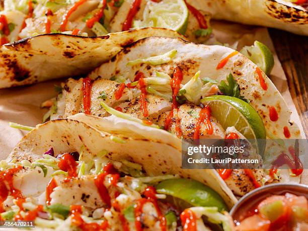 fish tacos - hot sauce stock pictures, royalty-free photos & images