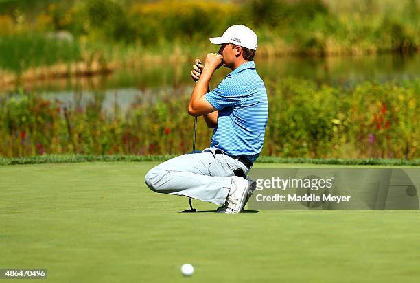 Jordan Spieth of the United States reacts after missing a putt on the sixteenth grren during round one of the Deutsche Bank Championship at TPC...