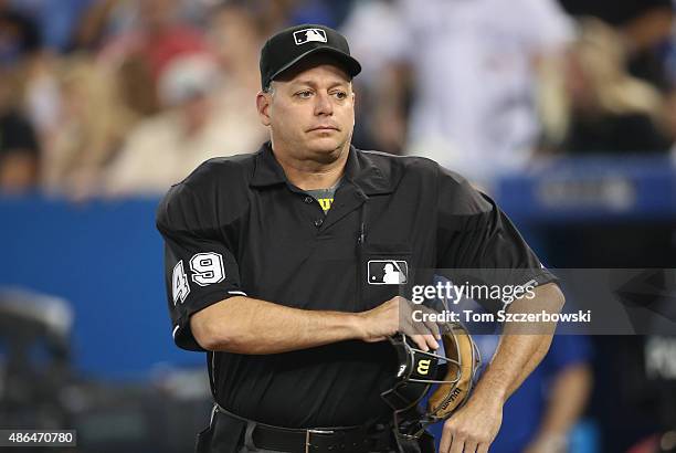 Home plate umpire Andy Fletcher during the Toronto Blue Jays MLB game against the Cleveland Indians on September 2, 2015 at Rogers Centre in Toronto,...