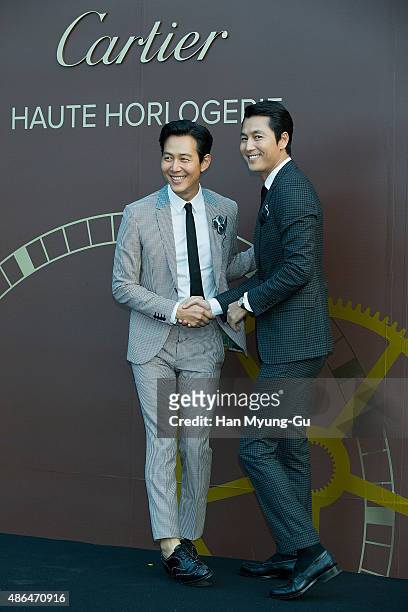 South Korean actors Lee Jung-Jae and Jung Woo-Sung attend the photo call for 2015 Cartier Fine Watchmaking Collection Event at Shilla Hotel on...