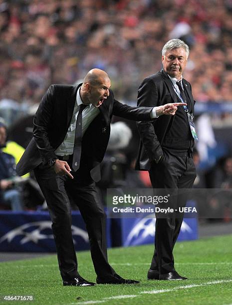 Zinedine Zidane shouts instructions as Real Madrid coach Carlo Ancelotti looks on during the UEFA Champions League Final between Real Madrid CF and...