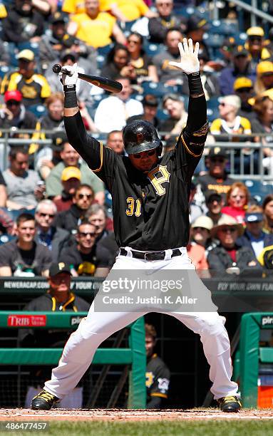 Jose Tabata of the Pittsburgh Pirates reacts to an inside pitch in the third inning against the Cincinnati Reds during the game at PNC Park April 24,...