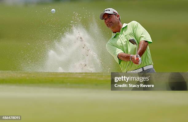 Chris Dimarco chips out of the bunker on the 18th during Round One of the Zurich Classic of New Orleans at TPC Louisiana on April 24, 2014 in...