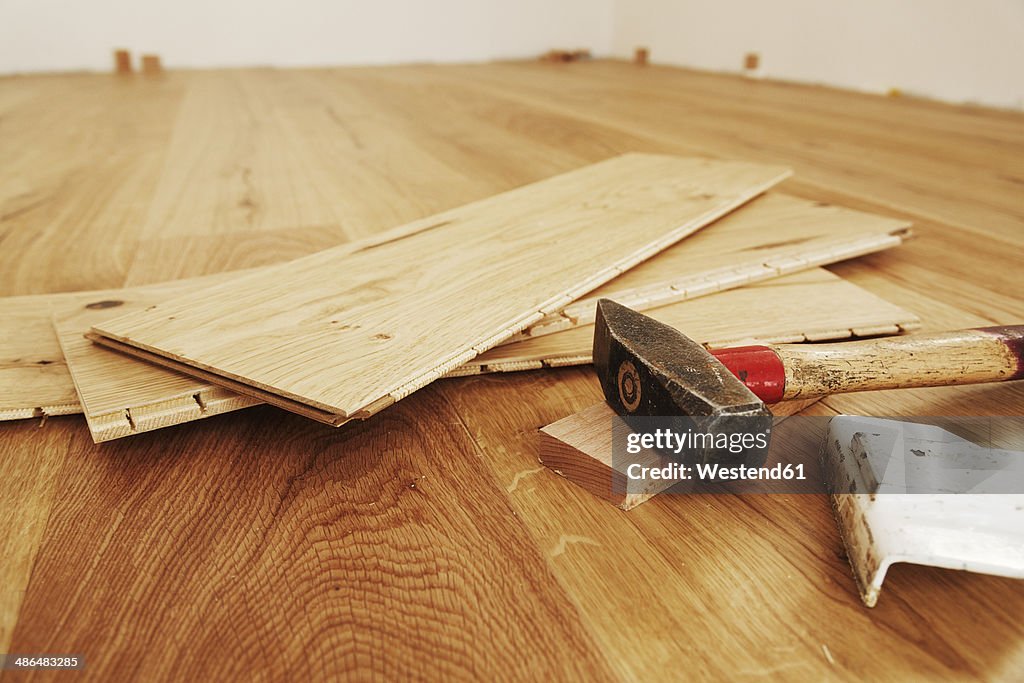 Laying finished parquet flooring, close-up