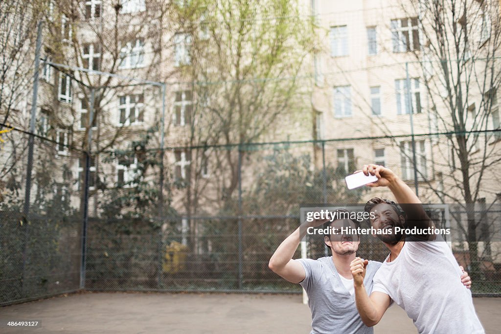 Friends Taking Selfie At Urban Soccer Ground