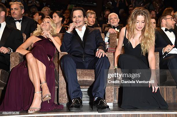 Jocelyne Cooper, Johnny Depp and Amber Heard attend a premiere for 'Black Mass' during the 72nd Venice Film Festival at on September 4, 2015 in...