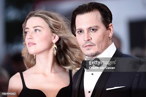 Johnny Depp and Amber Heard attend a premiere for 'Black Mass' during the 72nd Venice Film Festival at on September 4, 2015 in Venice, Italy.