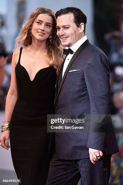 Johnny Depp and Amber Heard attend a premiere for 'Black Mass' during the 72nd Venice Film Festival at on September 4, 2015 in Venice, Italy.