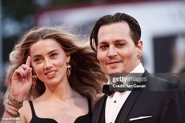 Johnny Depp and Amber Heard attend a premiere for 'Black Mass' during the 72nd Venice Film Festival at on September 4, 2015 in Venice, Italy.