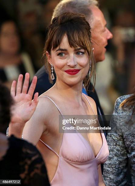 Dakota Johnson waves to the crowd at the premiere for 'Black Mass' during the 72nd Venice Film Festival on September 4, 2015 in Venice, Italy.