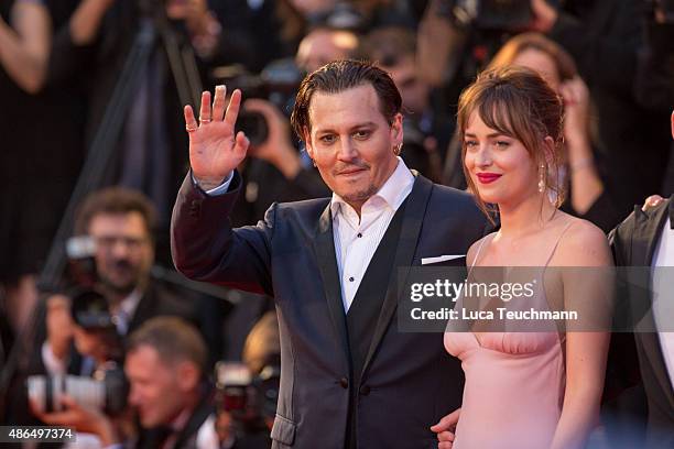 Johnny Depp and Dakota Johnson attend a premiere for 'Black Mass' during the 72nd Venice Film Festival at on September 4, 2015 in Venice, Italy.