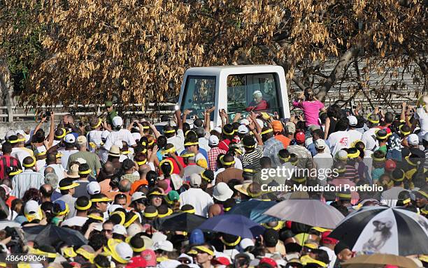 Mass celebrated by Pope Benedict XVI in Plaza de la Revoluci?n. The Pope riding through the believers in his armoured car. Havana, Cuba.