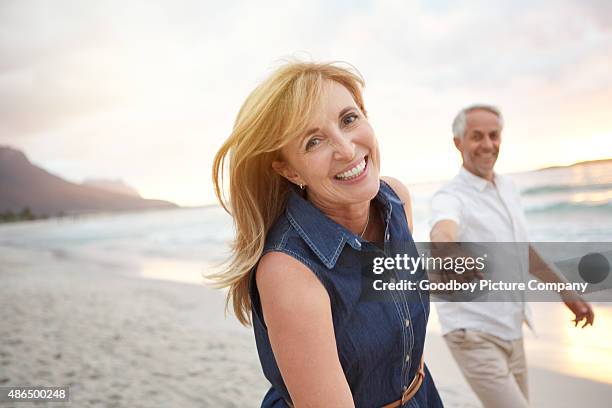 true love keeps the heart young - middle aged couple stock pictures, royalty-free photos & images