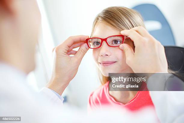 eye exam. - red eyeglasses stock pictures, royalty-free photos & images