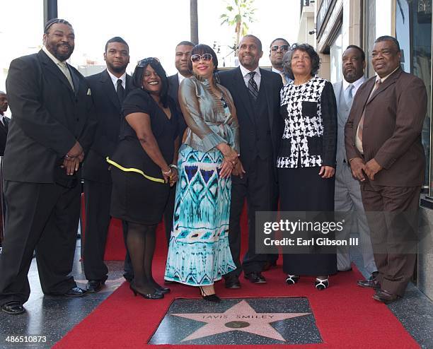 National Broadcaster Tavis Smiley poses with his family as he receives a Star on the Hollywood Walk of Fame on April 24, 2014 in Hollywood,...