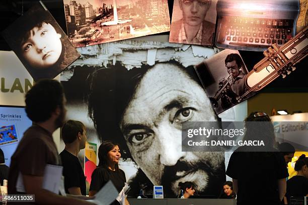 Pictures of Argentine novelist Julio Cortazar -- considered among the best Latin American writers of the 20th century -- are displayed at a stand of...