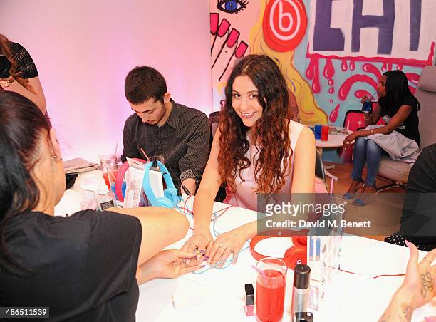 Eliza Doolittle enjoys a manicure at the Beats by Dr. Dre Drenched in Colour nail event on April 24, 2014 in London, England.