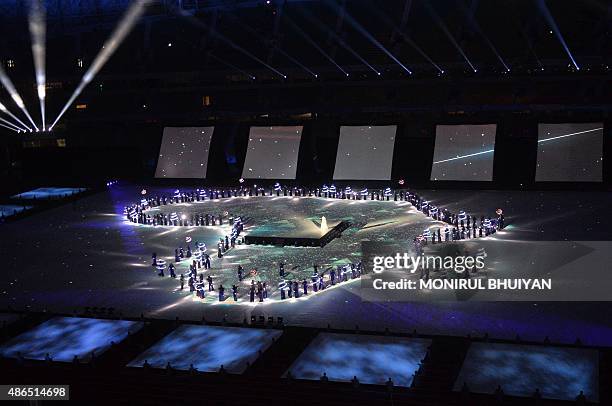 Artists performing during the opening ceremony of the 11th Africa Games in Brazzaville, on September 4, 2015. AFP PHOTO/MONIRUL BHUIYAN