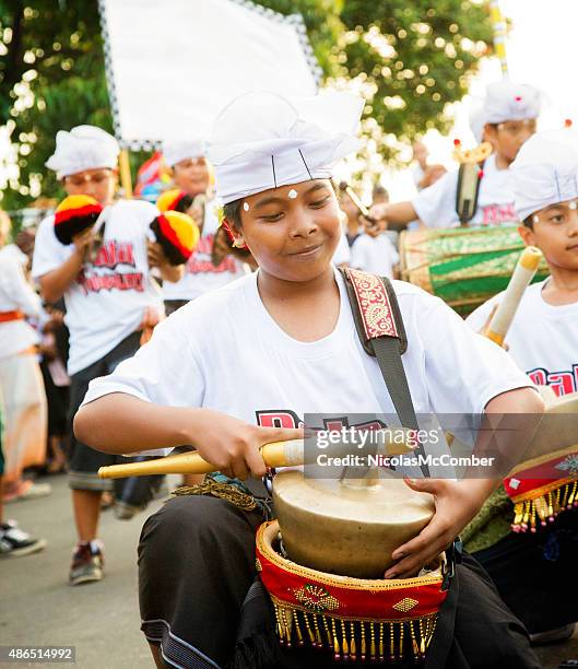 indonesian boy playing metallophone during nyepi ngrupuk parade bali indonesia - indonesian band stock pictures, royalty-free photos & images