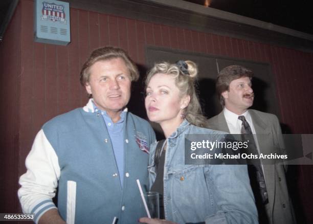 Beach Boy Bruce Johnston and Mamas and The Papas member Michelle Phillips outside of The Baked Potato on April 19, 1990 in Los Angeles, California.