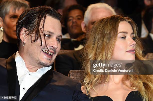 Johnny Depp and Amber Heard attend a premiere for 'Black Mass' during the 72nd Venice Film Festival on September 4, 2015 in Venice, Italy.