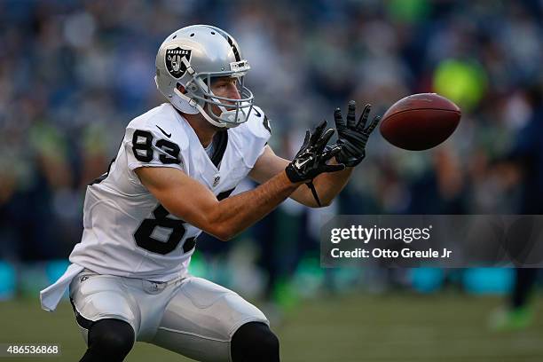 Wide receiver Kris Durham of the Oakland Raiders warms up prior to the game against the Seattle Seahawks at CenturyLink Field on September 3, 2015 in...