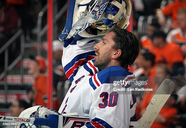 Henrik Lundqvist of the New York Rangers looks on against the Philadelphia Flyers in Game Three of the First Round of the 2014 Stanley Cup Playoffs...