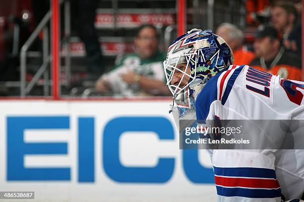 Henrik Lundqvist of the New York Rangers looks on against the Philadelphia Flyers in Game Three of the First Round of the 2014 Stanley Cup Playoffs...