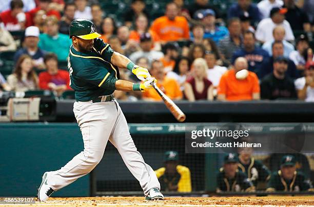 Alberto Callaspo of the Oakland Athletics hits a two-run home run in the third inning of their game against the Houston Astros at Minute Maid Park on...