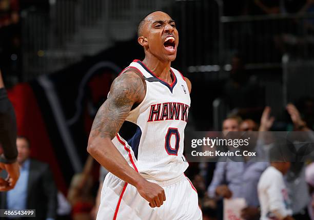 Jeff Teague of the Atlanta Hawks reacts after a dunk against the Indiana Pacers in Game 3 of the Eastern Conference Quarterfinals during the 2014 NBA...
