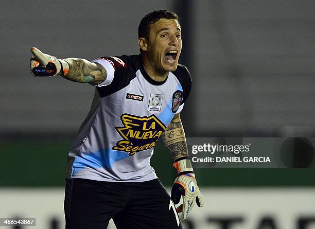 Argentina's Arsenal goalkeeper Cristian Campestrini shouts at teammates during the Libertadores Cup football match against Chile's Union Espanola, at...