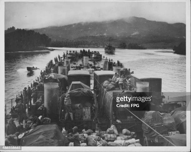 Landing Ship Tanks heading towards shore with men and supplies during the Pacific Campaign of World War Two, Rendova Island, Solomon Islands, circa...