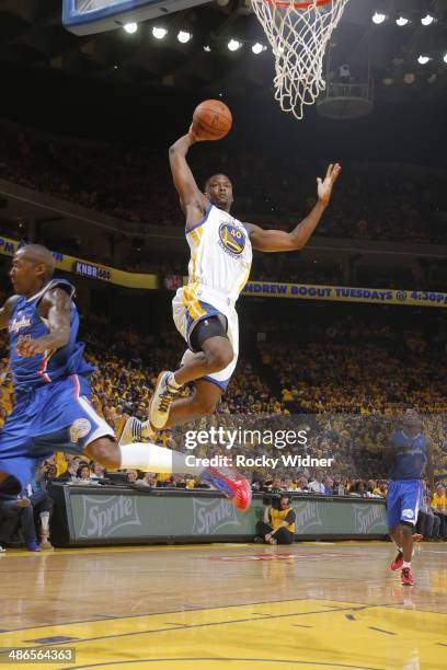 Harrison Barnes of the Golden State Warriors dunks against the Los Angeles Clippers in Game Three of the Western Conference Quarterfinals during the...