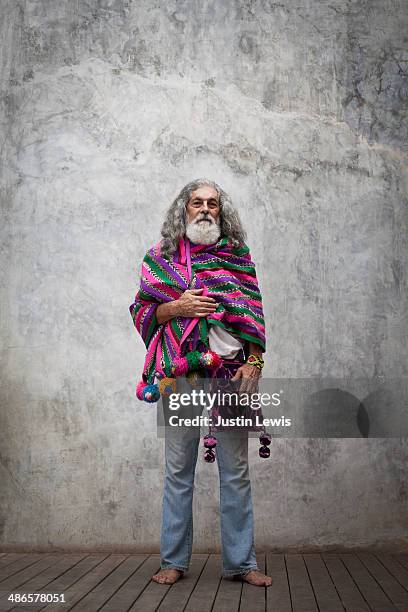 colorfully dressed older man standing solo - shawl stock pictures, royalty-free photos & images