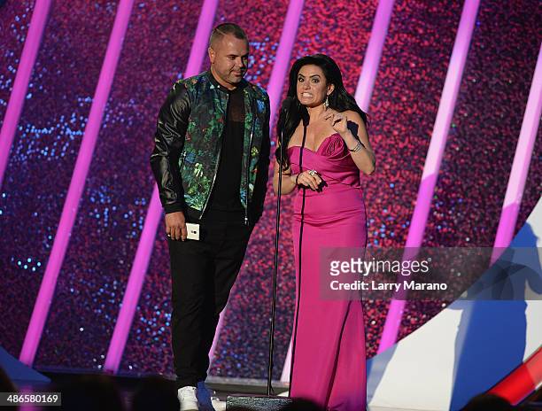 Juan Magan and Penelope Menchaca present onstage during the 2014 Billboard Latin Music Awards at Bank United Center on April 24, 2014 in Miami,...