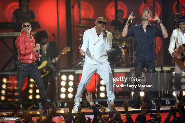 Gente de Zona and Enrique Iglesias perform onstage during the 2014 Billboard Latin Music Awards at Bank United Center on April 24, 2014 in Miami,...