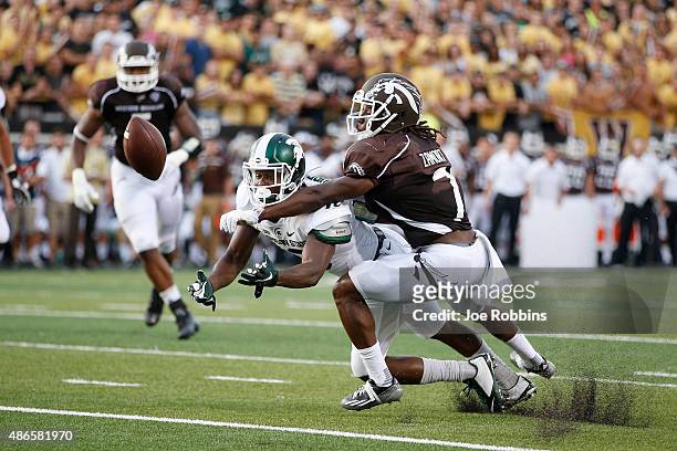 Ronald Zamort of the Western Michigan Broncos breaks up a pass intended for Aaron Burbridge of the Michigan State Spartans in the first half at Waldo...