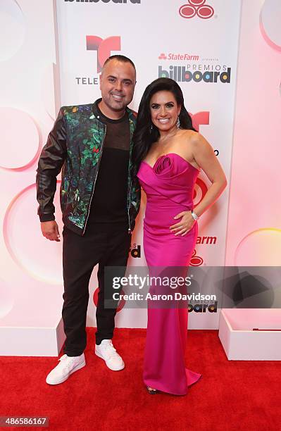 Juan Magan and Penelope Menchaca pose backstage at the 2014 Billboard Latin Music Awards at Bank United Center on April 24, 2014 in Miami, Florida.