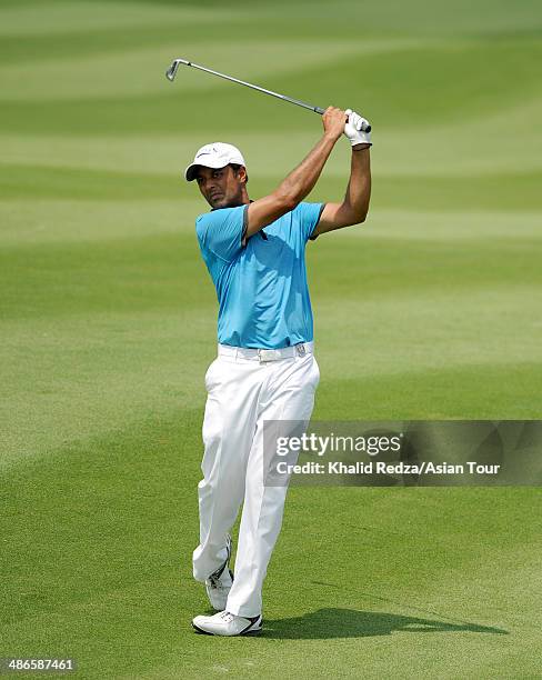 Arjun Atwal of India plays a shot during round two of the CIMB Niaga Indonesian Masters at Royale Jakarta Golf Club on April 25, 2014 in Jakarta,...