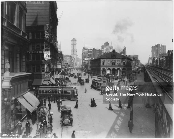 Herald Square, New York, New York, 1909. Herald Square Building and the Sixth Avenue elevated railroad tracks.