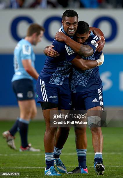 Lolagi Visinia of the Blues is congratulated on his try by Charles Piutau during the round 11 Super Rugby match between the Blues and the Waratahs at...