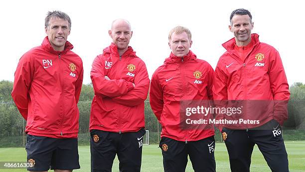 Interim Manager Ryan Giggs of Manchester United poses with his coaching staff of Phil Neville, Nick Butt and Paul Scholes at Aon Training Complex on...