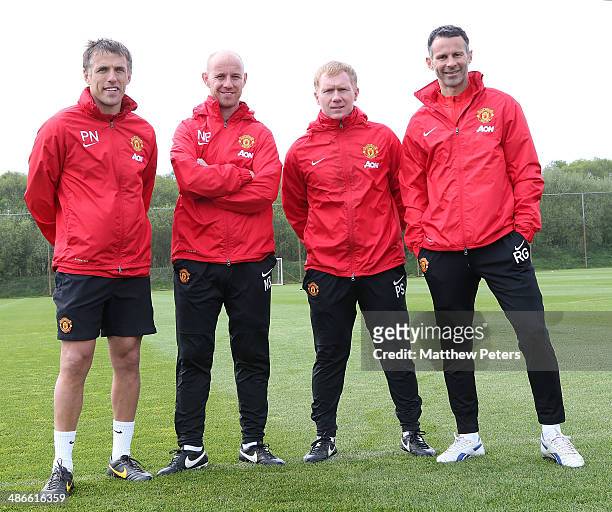 Interim Manager Ryan Giggs of Manchester United poses with his coaching staff of Phil Neville, Nick Butt and Paul Scholes at Aon Training Complex on...
